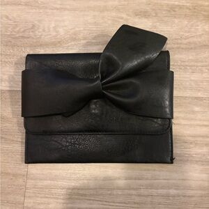 Black leather Clutch with Bow Detail by Anthropology